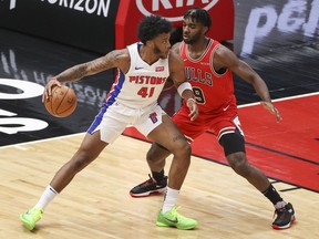 Chicago Bulls forward Patrick Williams defends against Detroit Pistons forward Saddiq Bey during the first half of an NBA game at United Center.