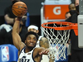 Utah Jazz guard Donovan Mitchell goes up for a dunk in the second half of the game against the Los Angeles Clippers at Staples Center.