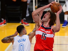 Washington Wizards center Robin Lopez moves to the basket against Los Angeles Lakers forward Kyle Kuzma during the second half at Staples Center.