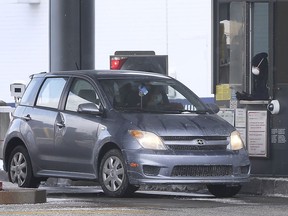 A vehicle in shown at an inspection booth at the Detroit-Windsor Tunnel in Windsor, ON. on Tuesday, Feb. 9, 2021.