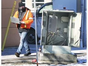 A Cogeco technician works at University Avenue West and Elm Avenue on Wednesday, Feb. 3, 2021. Cogeco service was temporarily affected in Windsor by vandalism.