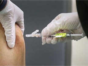 The local health unit has begun pop-up vaccination clinics in COVID-19 hot spots. Here, a local individual receives one of the first local COVID-19 vaccines at the St. Clair College SportsPlex on Dec. 22, 2020.