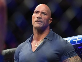 Dwayne 'The Rock' Johnson prepares to present the BMF belt after the fight between Jorge Masvidal and Nate Diaz during UFC 244 at Madison Square Garden in New York City, Nov. 2, 2019.