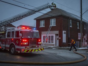 Fire crews battle a multi-unit residential fire on the corner of Drouillard Road and Richmond Street, Sunday, January 31, 2021.  (DAX MELMER/Windsor Star)