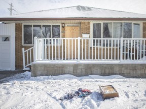 A house at 1302 Bridge Ave. sits boarded up after a late-night fire on Sunday, Feb. 14, 2021.