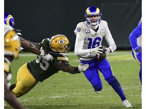 Los Angeles Rams quarterback Jared Goff  gets pressure from Green Bay Packers linebacker Za'Darius Smith in the fourth quarter at Lambeau Field.