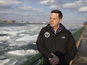 Aaron Fisk, a professor with the University of Windsor's Great Lakes Institute for Environmental Research, is leading a new project to help establish an early-warning system to protect water treatment plants from harmful algal blooms. He was photographed Wednesday with the Detroit River in the background.