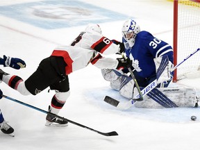 Toronto Maple Leafs goalie Michael Hutchinson (30) makes a save on a shot from Ottawa Senators forward Evgenii Dadonov (63) in the third period at Scotiabank Arena on Feb. 18, 2021.