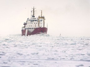 The Canadian Coast Guard icebreaker Griffon chugs up the icy Detroit River near Belle Isle on Monday, February 15, 2021.