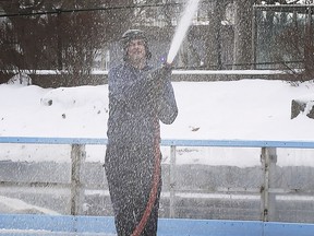It's baaack! City of Windsor employee Brad Day hoses down the Charles Clark Square skating rink while doing preparation on Friday, Feb. 19, 2021. The facility is scheduled to re-open on Monday, weather permitting.