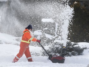 Winter wallop. City of Windsor worker Jenn Belleau uses a snowblower to clear a sidewalk in downtown Windsor on Tuesday, Feb. 16, 2021.
