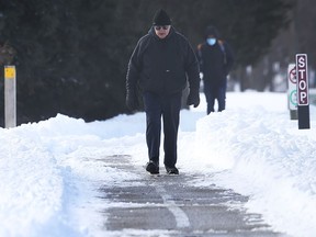 Walkers make use of Ganatchio Trail between Windsor and Tecumseh on Feb. 16, 2021.