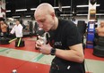 Windsor's Chucky Mady shows off his ability to tear open drink cans with his teeth. Photographed at Mady's Isshin-Ryu Dojo on Feb. 18, 2021.