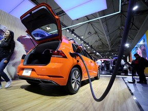 FILE - A Volkswagen E-Golf electric vehicle is displayed at the Canadian International Auto Show in Toronto, Ontario, Canada Feb. 18, 2020.