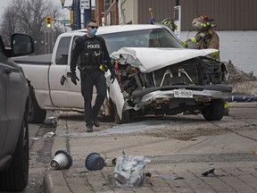 Emergency crews work at the scene of a single-vehicle collision at the XTR gas station on the corner of Ottawa Street and Langlois Avenue on Wednesday, Feb. 24, 2021.