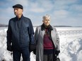 George and Vera Oglan of Windsor stand near the riverfront at Alexander Park, within view of Belle Isle, on Feb. 19, 2021.