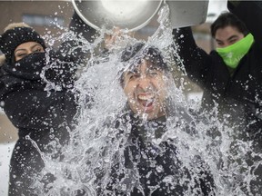 Windsor cool-down. Jorge Gutierrez, president of the St. Clair College student representative council, gets water dumped on him on Friday, Feb. 19, 2021, by fellow council reps Alexandra Hanna, left, and Christian Ceguin as part of this year's Virtual Windsor Polar Plunge for Special Olympics Ontario.