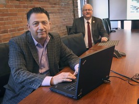 Joe Goncalves, left, director of investment attraction and corporate marketing with the WindsorEssex Economic Development Corporation and Stephen MacKenzie, president and CEO of the organization, are shown at their downtown Windsor office on Thursday, February 25, 2021. WEEDC is working  to bring a high-tech auto battery plant to the city.