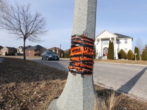 Several street lighting poles are patched up with duct and electrical tape in Southwood Lakes Tuesday, March 9, 2021.