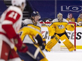 Juuse Saros of the Nashville Predators stands in net against the Detroit Red Wings during the third period at Bridgestone Arena on March 23, 2021 in Nashville, Tennessee. Nashville defeats Detroit 2-0.