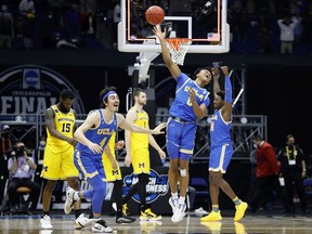 INDIANAPOLIS, INDIANA - MARCH 30: Jaylen Clark #0 of the UCLA Bruins celebrates defeating the Michigan Wolverines 51-49 in the Elite Eight round game of the 2021 NCAA Men's Basketball Tournament at Lucas Oil Stadium on March 30, 2021 in Indianapolis, Indiana.