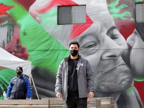 Via Italia Heritage Mural artist Dave "DERKZ" Derkatz, right, and Joe Busico admire Derkatz's work in Via Italia Community Gardens Tuesday, March 16, 2021. Earlier, Tourism Windsor Essex Pelee Island launched Nonna's Shopping List digital passport, providing both locals and visitors with the opportunity to explore cuisine, retail, culture and history in Windsor's Little Italy district. This partnership program offers 16 businesses or attractions to visit and get access to VIP savings and prizes.