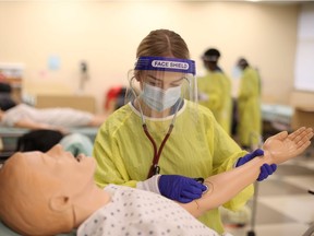 Personal support worker students are shown training at St. Clair College in Windsor in December 2020.