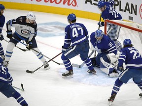 Adam Lowry (17) scores against Toronto Maple Leafs in the third period at Scotiabank Arena in Toronto on Saturday, March 13, 2021.