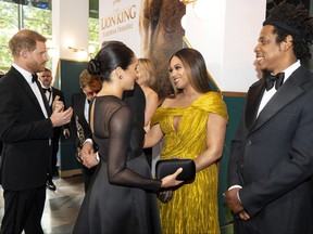 Prince Harry, Duke of Sussex, left, and Meghan, Duchess of Sussex (second from left) meets cast and crew, including Beyonce Knowles-Carter (centre) Jay-Z as they attend the European premiere of Disney's "The Lion King" at Odeon Luxe Leicester Square on July 14, 2019 in London.