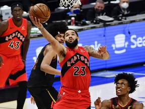 Raptors guard Fred VanVleet drives to the basket while Cavaliers' Collin Sexton defends during the third quarter at Rocket Mortgage FieldHouse in Cleveland on Sunday, March 21, 2021.
