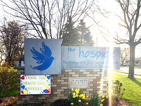 The sun rises behind the entrance sign of The Hospice of Windsor and Essex County at 6038 Empress St. in Windsor.