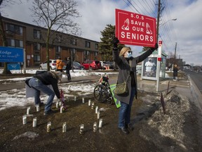 People demonstrate in support of the well-being of long-term care home residents outside of Kennedy Lodge Long Term Care Home in Scarborough.