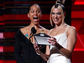 Alicia Keys and Dua Lipa react as they read the name of Billie Eilish to win the best Best New Artist award at the 62nd Grammy Awards show in Los Angeles, Calif., Jan. 26, 2020.