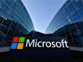The logo of French headquarters of American multinational technology company Microsoft is pictured outside on March 6, 2018 in Issy-Les-Moulineaux, a Paris' suburb. - Microsoft has said a state-sponsored hacking group operating out of China is exploiting previously unknown security flaws in its Exchange email services to steal data from business users.