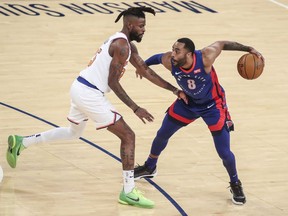 Detroit Pistons guard Wayne Ellington is guarded by New York Knicks forward Reggie Bullock in the second quarter at Madison Square Garden.