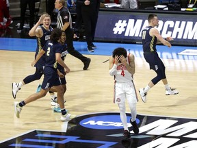 Ohio State Buckeyes guard Duane Washington Jr. mourns their loss to Oral Roberts Golden Eagles in overtime during the first round of the 2021 NCAA Tournament on Friday, March 19, 2021, at Mackey Arena in West Lafayette, Ind.