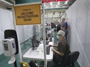 The Covid-19 vaccine registration desk at the St. Clair College SportsPlex field hospital is shown on Tuesday, December 22, 2020.