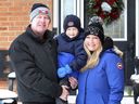 Todd and Katie Cox pose with their son Benjamin, 6, at their Windsor home on Feb. 16, 2021. 