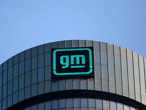 FILE PHOTO: The new GM logo is seen on the facade of the General Motors headquarters in Detroit, Michigan, U.S., March 16, 2021.