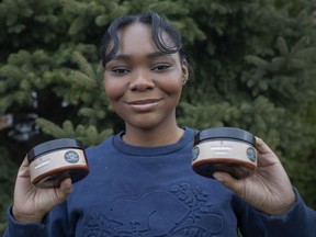 Efe Eghujovbo, a Grade 12 student at Assumption College Catholic High School, holds some of her haircare products she's now selling, on Monday, March 15, 2021.