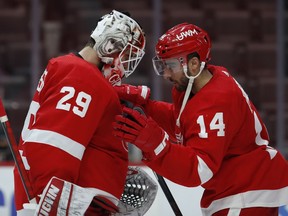 Detroit Red Wings center Robby Fabbri and goaltender Thomas Greiss celebrate together after the game against the Dallas Stars at Little Caesars Arena.