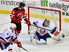 New York Islanders goalie Semyon Varlamov makes a glove save on a shot by New Jersey Devils center Pavel Zacha (not pictured) during the second period at Prudential Center.