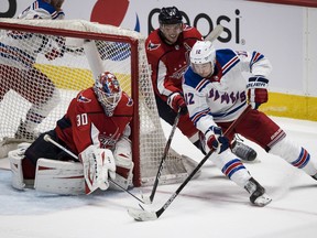 New York Rangers right wing Julien Gauthier attempts a wrap around against Washington Capitals goaltender Ilya Samsonov during the third period at Capital One Arena.