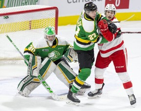 Kirill Steklov of the London Knights battles with Tye Kartye of the Soo Greyhounds in front of Knights goalie Brett Brochu during the first period of their game on Feb. 28, 2020 in London. (Derek Ruttan/The London Free Press)