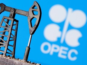 A 3D printed oil pump jack is seen in front of displayed OPEC logo in this illustration picture, April 14, 2020.
