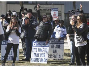 More than 100 people participated in a rally organized by the Open Ontario group on Saturday, March 20, 2021, at the Windsor Regional Hospital Ouellette Campus. They were speaking out against restrictions to small businesses. A portion of the participants are shown during the event.