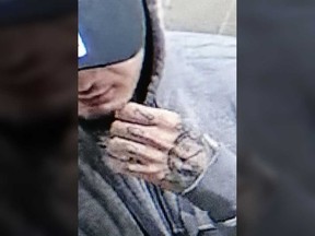A close-up of a surveillance camera image of Robert Labrecque, 20, of Windsor, showing his distinctive hand tattoos. Labrecque is wanted by Windsor police on a charge of attempted murder in relation to a shooting that occurred Feb. 27, 2021.