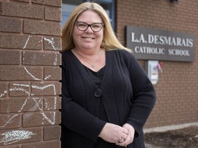 Robbie-Lynne Schreindler is pictured outside LA Desmarais Catholic Elementary School on Wednesday, March 9, 2021, where she teaches Grade six.  Schreindler attended the school as a student from 1976-1985 and has been a teacher there since 2002.