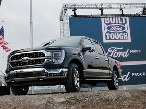 FILE PHOTO: Ford Motor Co. displays a new 2021 Ford F-150 pickup truck at the Rouge Complex in Dearborn, Michigan, U.S. September 17, 2020.