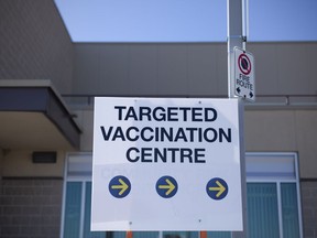 Vaccination centre signs are posted outside the WFCU Centre on Tuesday, March 2, 2021.
